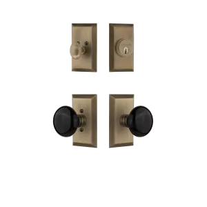 Studio Entry Set with Black Porcelain Knob in Antique Brass